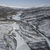 Frozen river in valley in winter, Putoransky State Nature Reserve, Putorana Plateau, Siberia, Russia