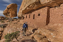 Ancestral Puebloan ruins and photographer, Road Canyon, Bears Ears National Monument, Utah