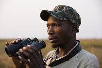 Shoebill (Balaeniceps rex) biologist, Elijah Mofya, Bangweulu Wetlands, Zambia