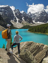 Hikers near glacial lake, Moraine Lake, Banff National Park, Alberta, Canada