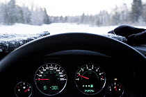 Car thermometer showing well below freezing temperatures in boreal forest in winter, Riding Mountain National Park, Manitoba, Canada