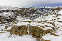 Snow-covered boulders and canyon, Dettifoss Waterfall, Vatnajokull National Park, Iceland