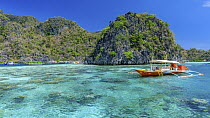 Boat near tropical island, Coron Island, Philippines