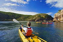 Tourists sea kayaking, Whitsunday Island, Queensland, Australia