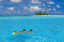 Snorkelers in tropical lagoon, Keeling Islands, Australia