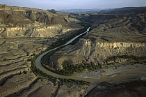 Rio Grande flowing through arid landscape in the Sierra del Carmen region, Mexico