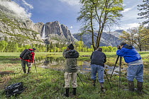 Photographers photographing Yosemite Falls, Yosemite National Park, California