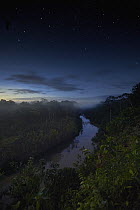 River in tropical rainforest at dusk, Tambopata Research Center, Peru