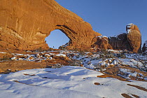 North Window sandstone arch with tourist, Arches National Park, Utah