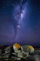 Granite rocks with lichen and Milky Way, Bicheno, Tasmania, Australia