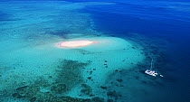 Boat near sand island, Beaver Cay, Great Barrier Reef, Queensland, Australia