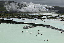 Tourists soaking in Blue Lagoon spa at Svartsengi Geothermal Power Plant, Reykjanes Peninsula, Iceland
