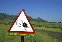 Dung Beetle (Scarabaeidae) road sign cautioning drivers that Dung Beetles have the right of way, Itala Game Reserve, South Africa