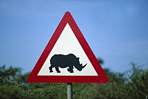 Rhinoceros (Diceros sp) warning sign along side of the road, Phinda Game Reserve, South Africa