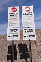 Invasive species warning sign at reservoir, Lake Mead National Recreation Area, Nevada