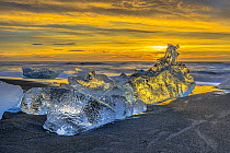 Ice chunk on beach at sunset, Diamond Beach, Iceland