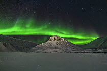 Northern lights over mountain, Longyearbyen, Iceland
