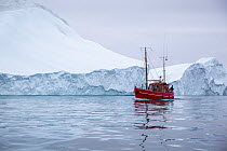 Boat and iceberg, Disko Bay, Ilulissat, Greenland