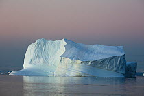 Iceberg in fjord at dawn, Scoresby Sound, Greenland