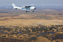 Bush plane flying, Moremi Game Reserve, Okavango Delta, Botswana