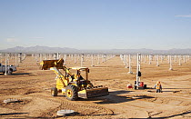 Solar panels being installed at the Blythe Solar Power Project, a 4-unit 485-megawatt solar photovoltaic facility, California
