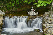 Religious statue and waterfall, Mount Mian, China