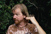 Mark Moffett, photographer portrait, holding a Tarantula (Theraposidae) while on assignment