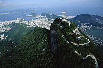 Statue of Christ the Redeemer towers over the 8,150 acre Tijuca National Park, one of the world's largest urban forests, Rio de Janeiro, Atlantic Forest ecosystem, Brazil
