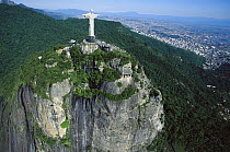 Statue of Christ the Redeemer towers over the 8,150 acre Tijuca National Park, one of the world's largest urban forests, Rio de Janeiro, Atlantic Forest ecosystem, Brazil