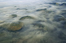 Aerial view of deforestation under cloud-cover, Atlantic Forest ecosystem west of Rio de Janeiro, Brazil