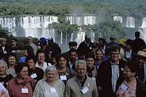 Tourists at the Iguacu Falls, world's largest waterfalls and the largest tourist attraction in the Atlantic Forest ecosystem, Brazil and Argentina border