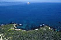 Aerial view of the coast showing finger rock on the background, San Cristobal Island, Galapagos Islands, Ecuador