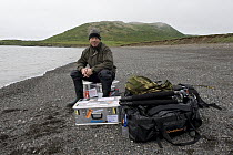 Wildlife photographer Ingo Arndt with equipment, heading for Bristol Bay, Round Island, Alaska