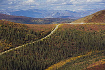Recreational vehicle driving on the Top of the World Highway between Dawson City, Yukon, and Tok, Alaska