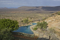 Arid landscape and swimming pool at Saruni Lodge, Kalama Wildlife Conservancy, Kenya