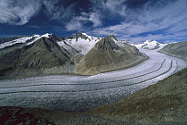 Aletsch Glacier moving through the Swiss Alps showing lateral and medial moraines, Wallis, Switzerland