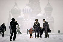 Tourists in Red Square at Basil's Cathedral, Moscow, Russia