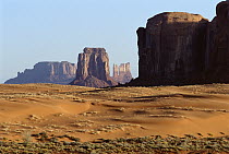 Eroded buttes and sand dunes in Monument Valley Navajo Tribal Park, Arizona
