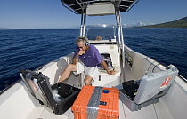 Humpback Whale (Megaptera novaeangliae) researcher Jim Darling listening to and recording whale songs, Humpback Whale National Marine Sanctuary, Maui, Hawaii