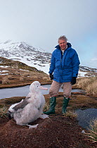 David Attenborough with wandering albatross chick, South Georgia, 1992, on location for BBC series Life in the Freezer