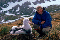 David Attenborough with Wandering albatross chick (Diomedea exulans), South Georgia, while on location for 'Life in the Freezer' 1992