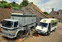 Filming vehicles in farm yard for Bird in the Nest series, 1994