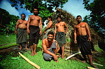 Niuafo'ou villagers outside the fale hut the have built in a day, Tonga