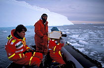 Alastair Fothergill and Paul Atkins filming off rubber dinghy, filming for BBC Life in the Freezer series