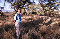 David Attenborough and African elephants (Loxodonta africana) on location for BBC Private Life of Plants, Lewa Downs, Kenya, 1993