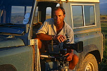 Martyn Colbeck on location in Amboseli NP, Kenya, filming from Landrover for BBC television programme "Echo of the Elephants: The next Generation" filmed 1992-1995, Kenya