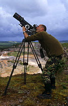 Simon King filming in a quarry for BBC programme, England, UK
