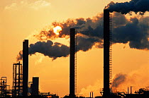 Air pollution: sun shining through smoke from the Sevalco plant at Avonmouth, Bristol, UK