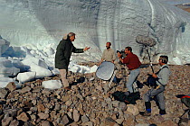 David Attenborough with film crew on Ellesmere Island, when on location as presenter of BBC television series 'The Private Life of Plants' 1995