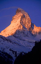 Matterhorn mountain with sun on upper slopes. Switzerland